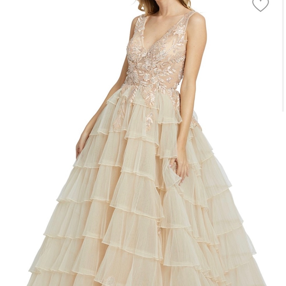 Worn once Mac Duggal gown in ivory . Gown is very light weight .